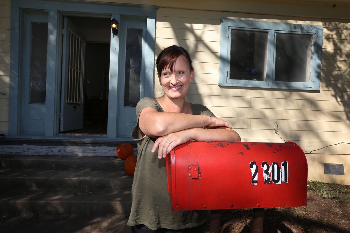 Luann in front of the Good Neighbor House